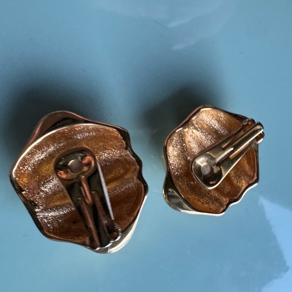 Large gold tone clip on vintage earrings